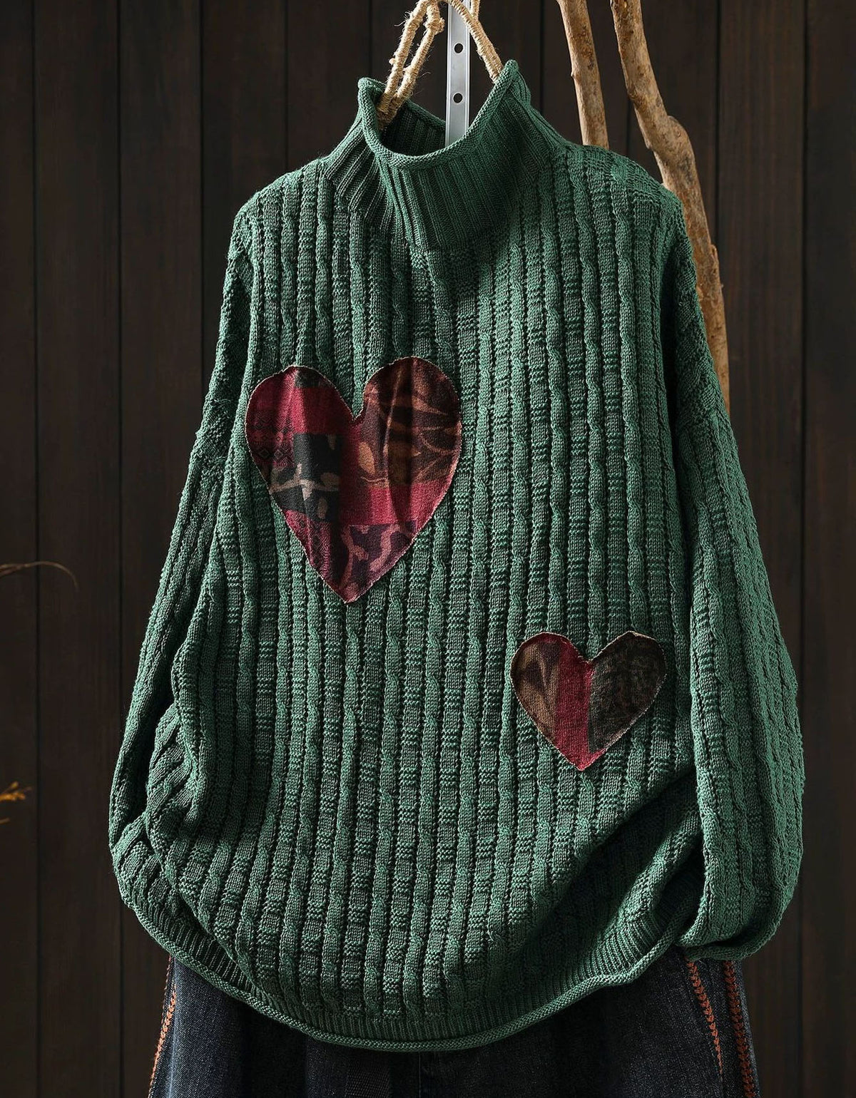 Women's green chunky rib knit sweater with plaid heart patches