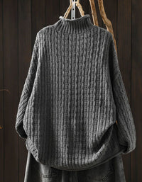 Women's chunky rib knit sweater with plaid heart patches back view