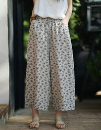Women wearing floral linen wide leg pants with elastic waist