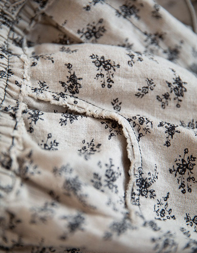 Details of lightweight women’s floral linen pants in relaxed wide leg cut