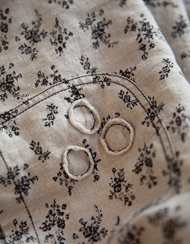 Close-up of floral print linen pants showing breathable fabric texture