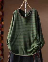 Green striped women's knit top with round neckline and long sleeves