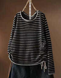Black striped women's knit top with round neckline and long sleeves