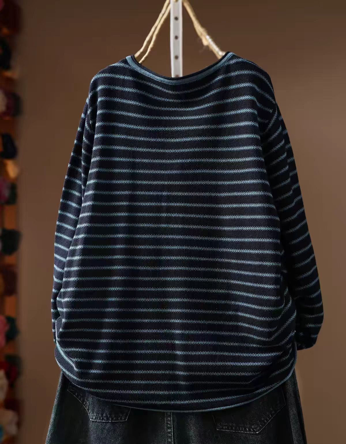 Women's navy striped long sleeve top styled with casual jeans