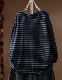 Women's navy striped long sleeve top styled with casual jeans