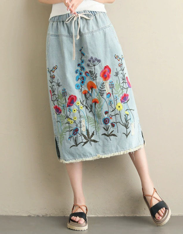 boho style women wearing embroidered denim skirt casual outfit