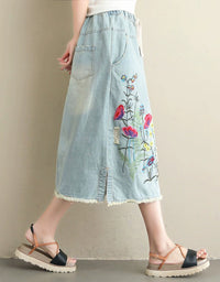 women’s light blue drawstring denim skirt with floral embroidery side view