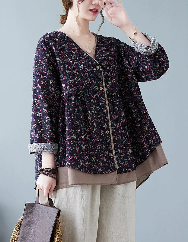 Side view of navy floral pattern on women’s button-up v-neck top in navy blue