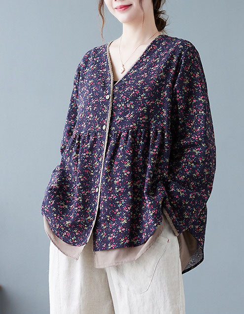 Navy women’s floral button front v-neck top paired with casual pants