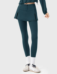 Person wearing teal athletic pants and jacket on a white background