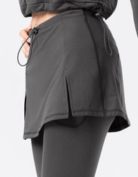 Dark gray athletic shorts with a drawstring on a light gray background