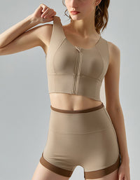 Woman wearing a beige shapewear outfit on a plain background