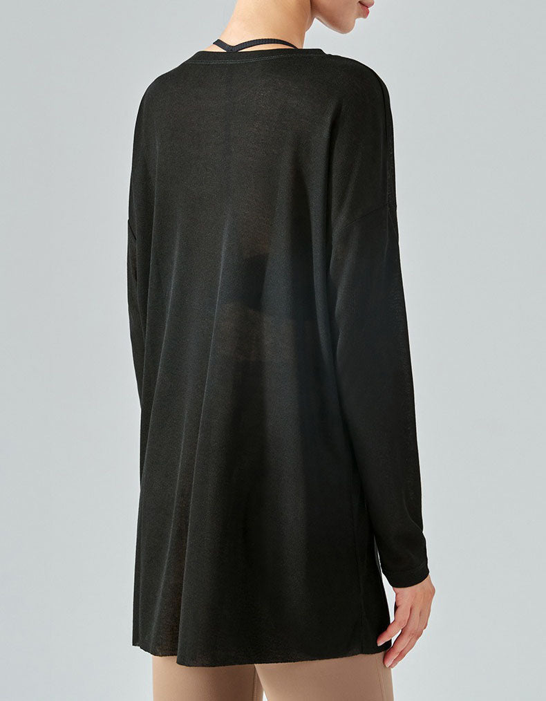 Black long-sleeve dress worn by a person on a gray background back view