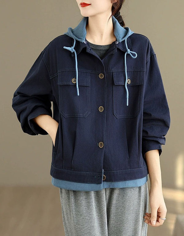 Full-length view of a woman in a denim jacket with hoodie, paired with comfortable pants