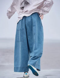 Back view of women styling casual wide leg denim trousers with sneakers