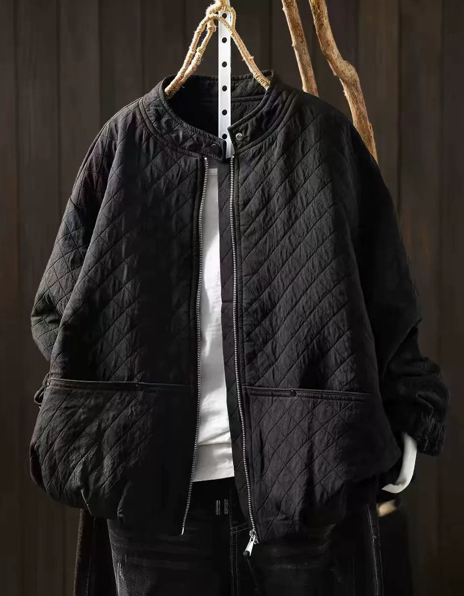 Ivory diamond-quilted women's jacket with snap collar and front zipper on a hanger