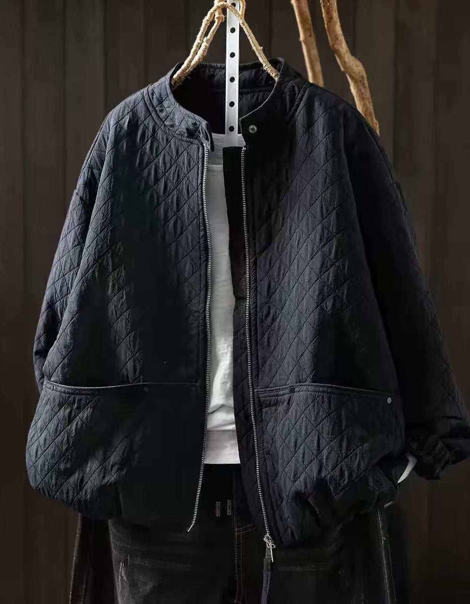 Ivory diamond-quilted jacket with oversized sleeves and roomy front pockets with snap details