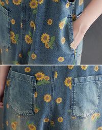 Close-up of sunflower floral print on women’s denim dungarees