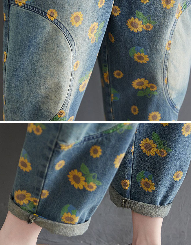Close-up of women’s vintage sunflower print denim overallsbackground