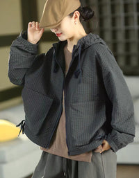 Roomy front pockets on a navy checkered hooded zip-up jacket