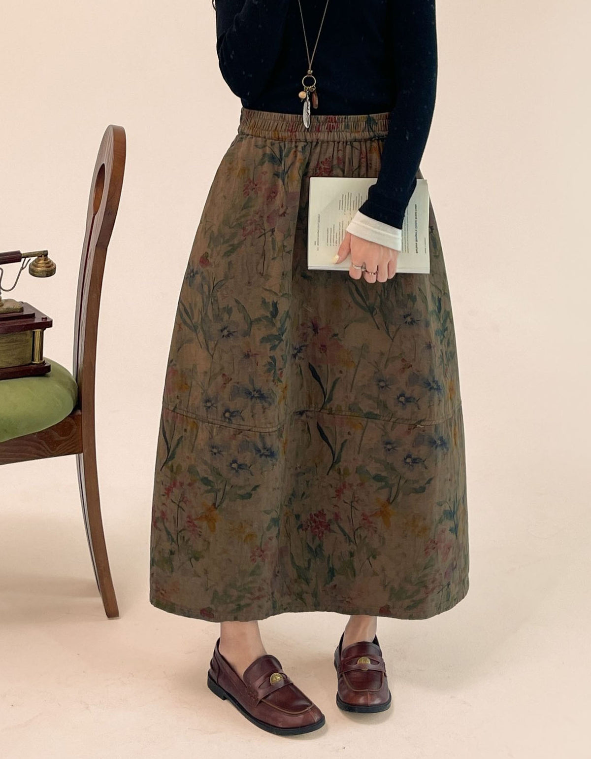Women's dark floral print midi skirt with relaxed flowing silhouette