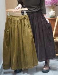 Women's wide leg corduroy culotte pants styled with a casual top and ankle boots