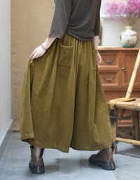 Back view of women's high waist corduroy culotte pants with a relaxed wide leg fit