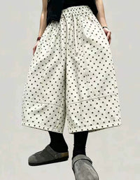 Women's casual oversized polka dot cropped pants paired with sandals