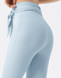 Light blue ribbed leggings with a tie detail on a white background back view