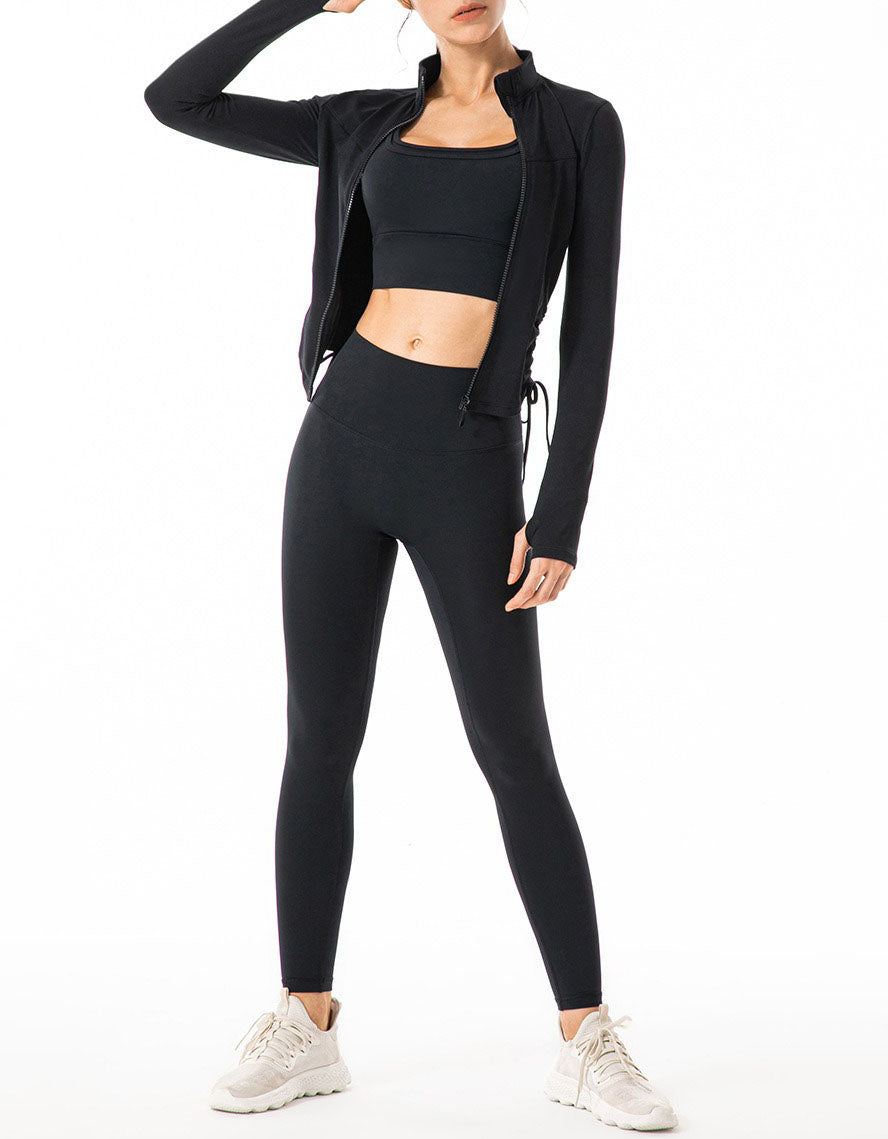 Person wearing a black athletic outfit on a white background