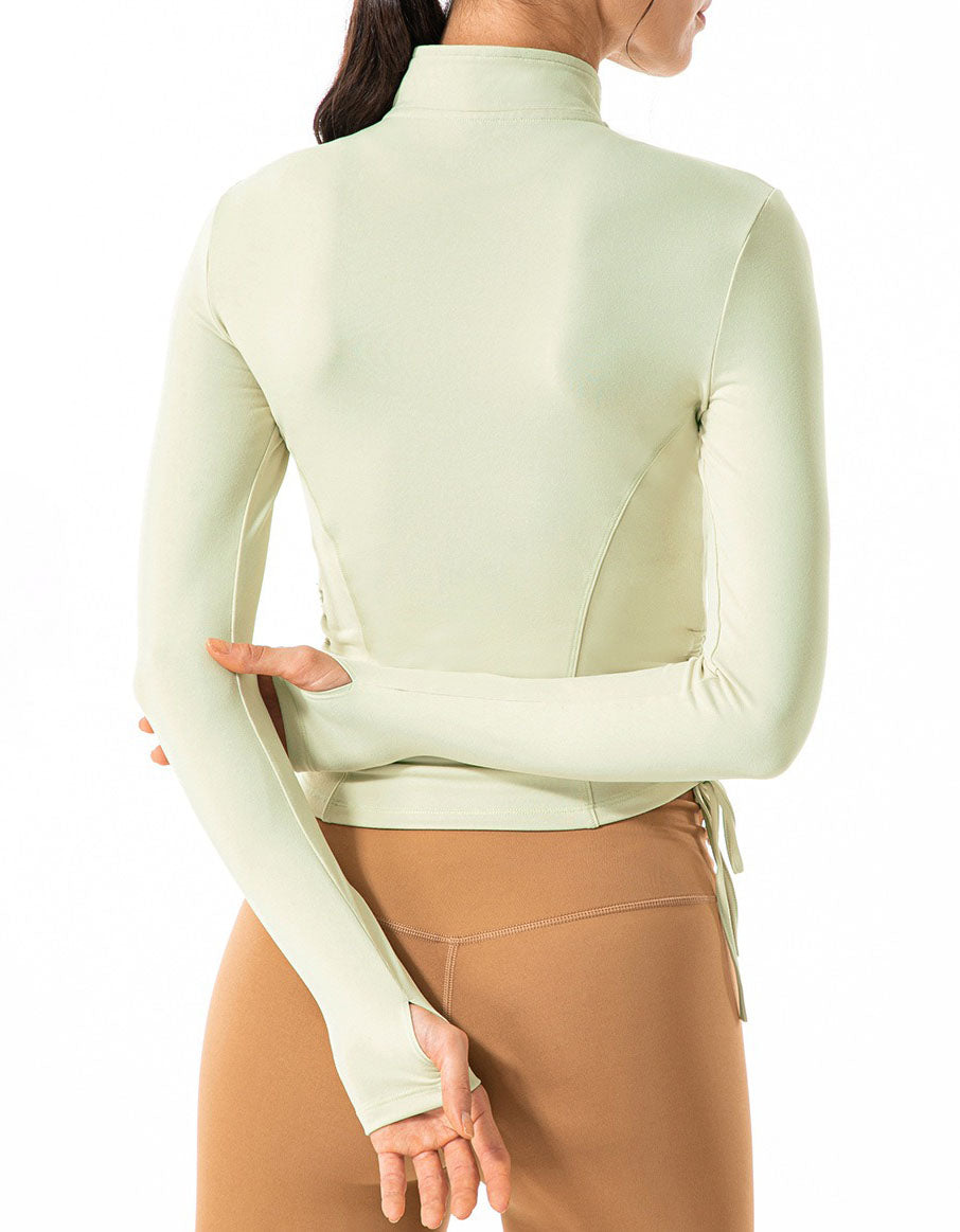 Light green turtleneck sweater worn by a person on a white background