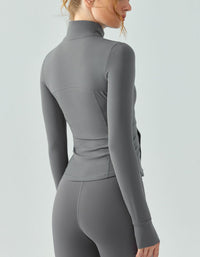 Gray long-sleeve top and leggings on a plain background back view