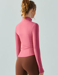 Person wearing a pink long-sleeve top against a light gray background back view
