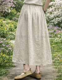 Comfortable linen long skirt with side pockets and flat front pleats.
