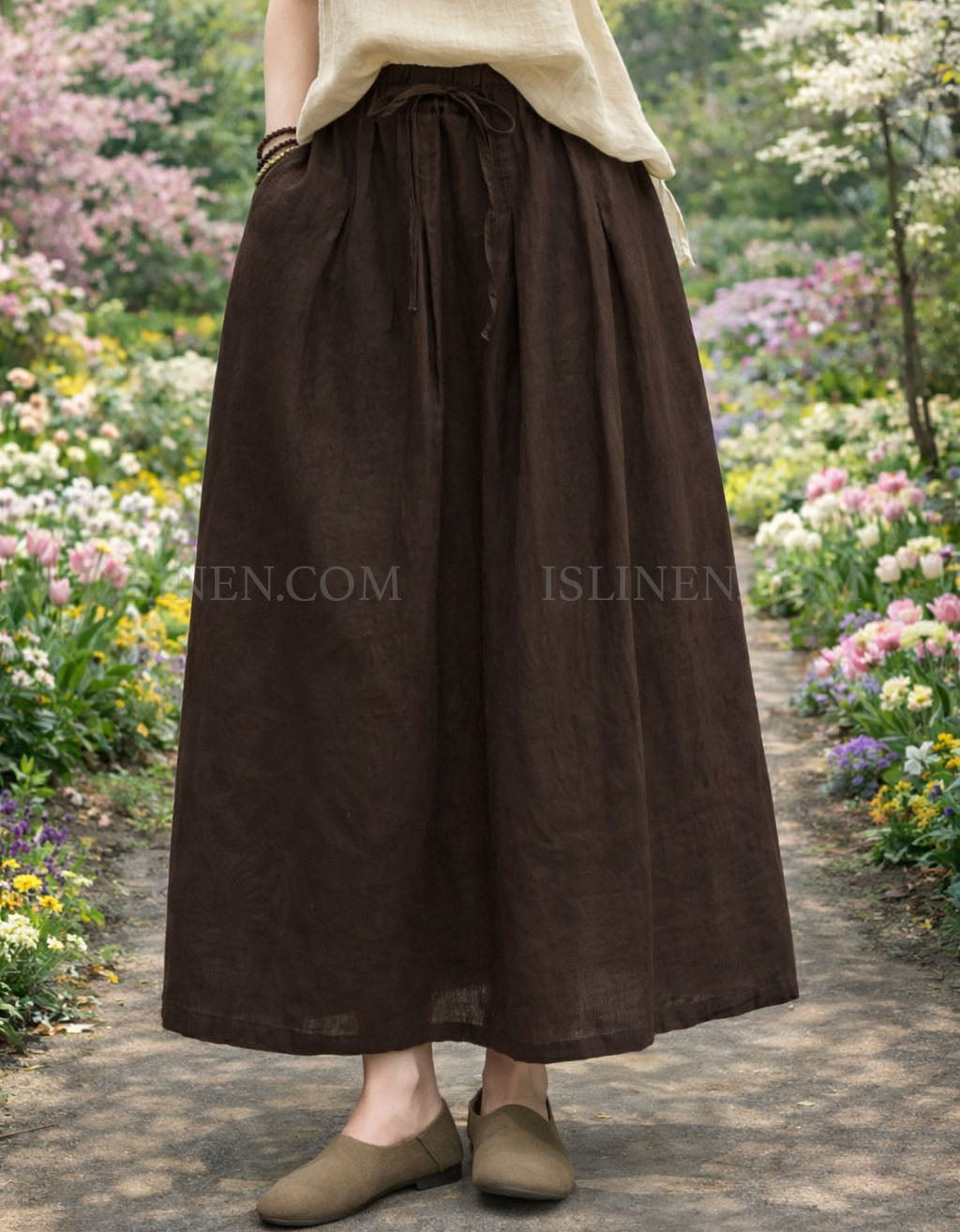 High waist linen maxi skirt in light beige, worn with matching linen top.