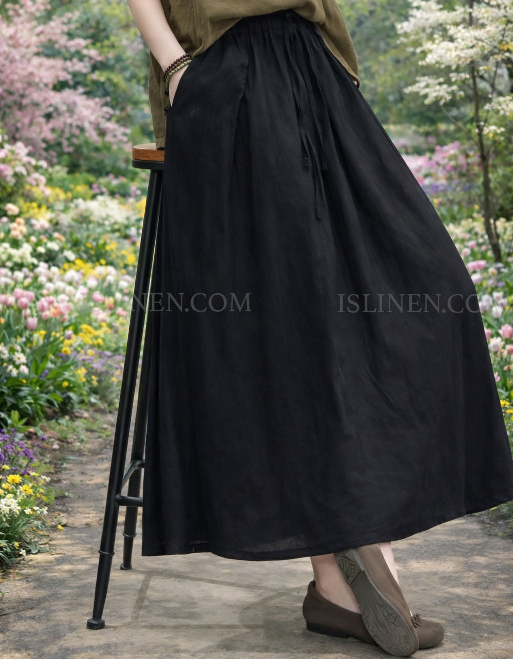 Breathable linen maxi skirt for women, neutral beige with gathered waistband.