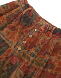Close-up of floral pattern and button details on corduroy shorts