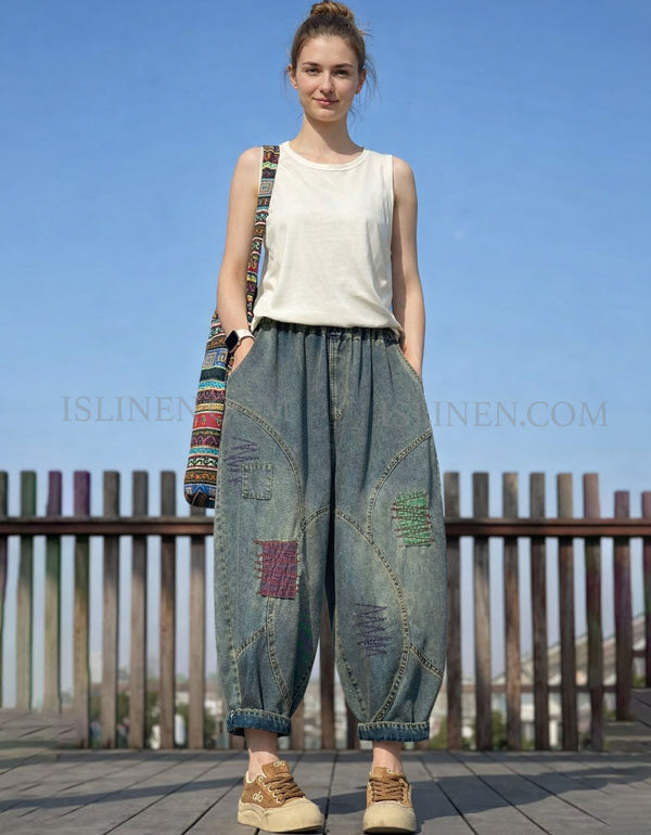 Patchwork baggy denim pants styled flat with casual tee and sneakers for a boho streetwear outfit