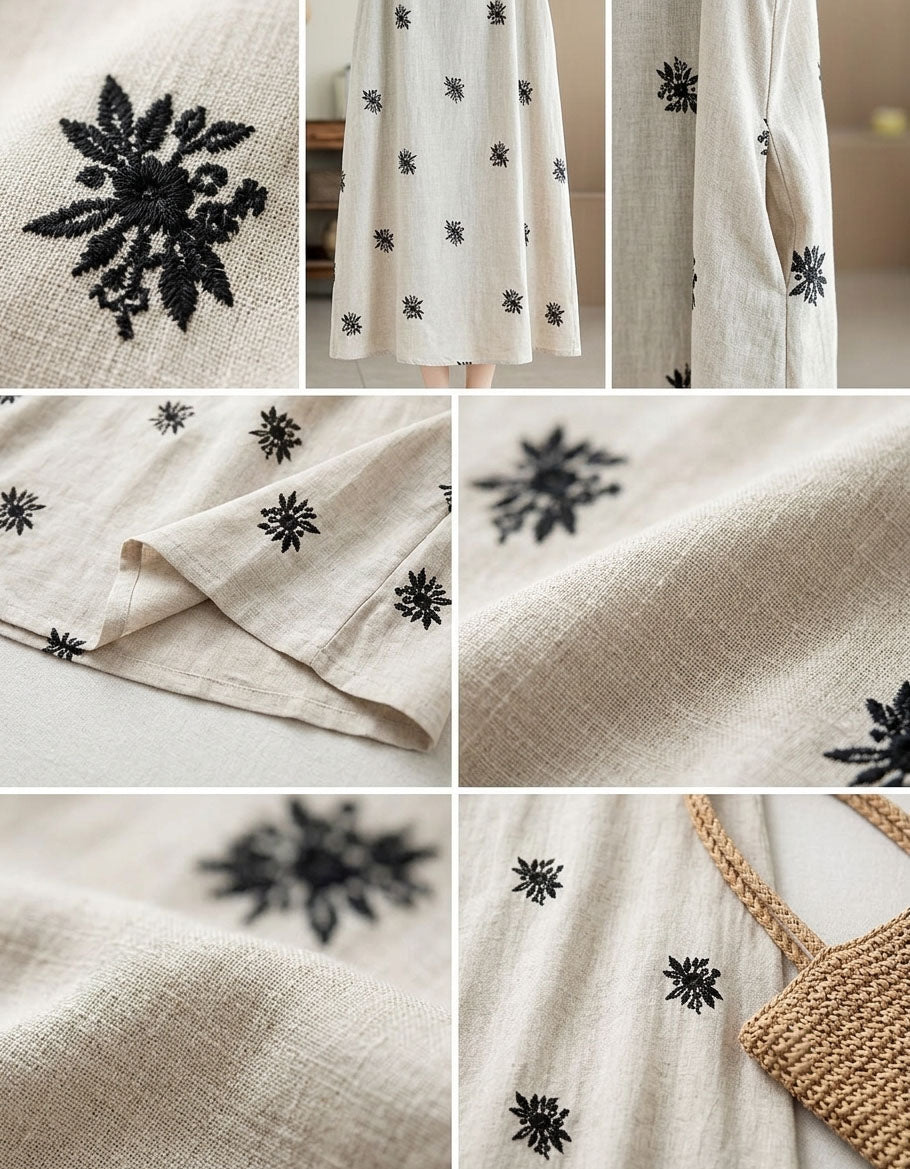 Close-up of black floral embroidery on linen blend fabric