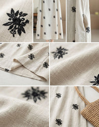 Close-up of black floral embroidery on linen blend fabric
