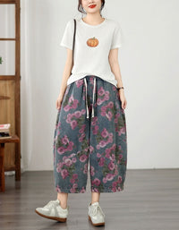 Front view of relaxed fit floral rose denim cropped wide leg pants
