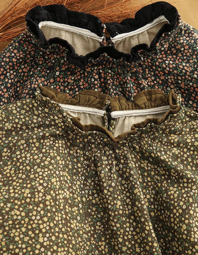 Close-up of a vintage-style floral dress with a ruffled collar and gathered bodice, featuring a dense small floral print in olive green, cream, and muted red tones.