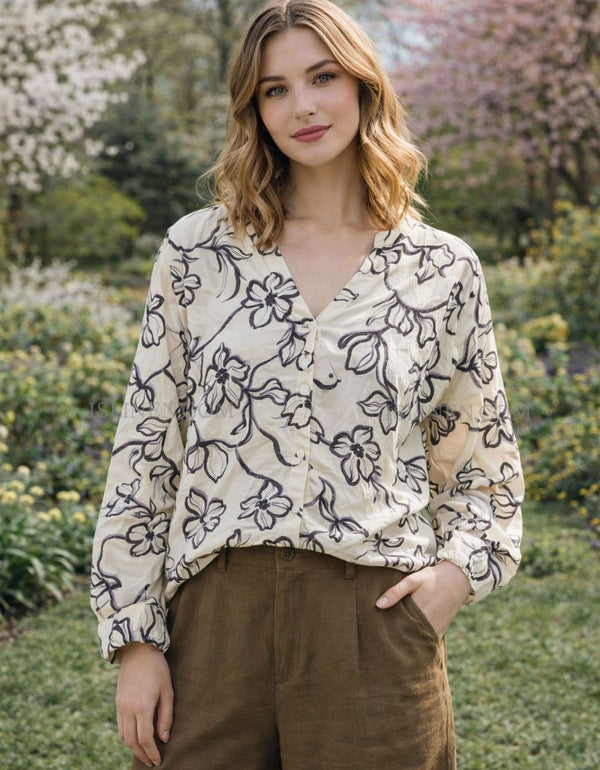 Women’s floral button-up blouse with a relaxed fit and v-neckline