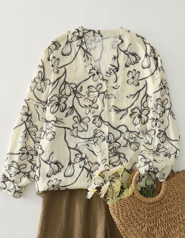 Front view of women’s floral blouse with button front and casual style