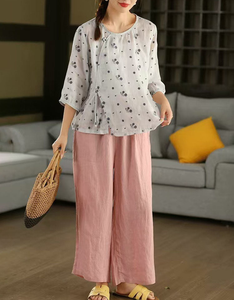 Women’s white linen blouse paired with wide leg pants, comfortable casual outfit inspiration