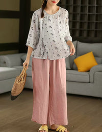 Women’s white linen blouse paired with wide leg pants, comfortable casual outfit inspiration