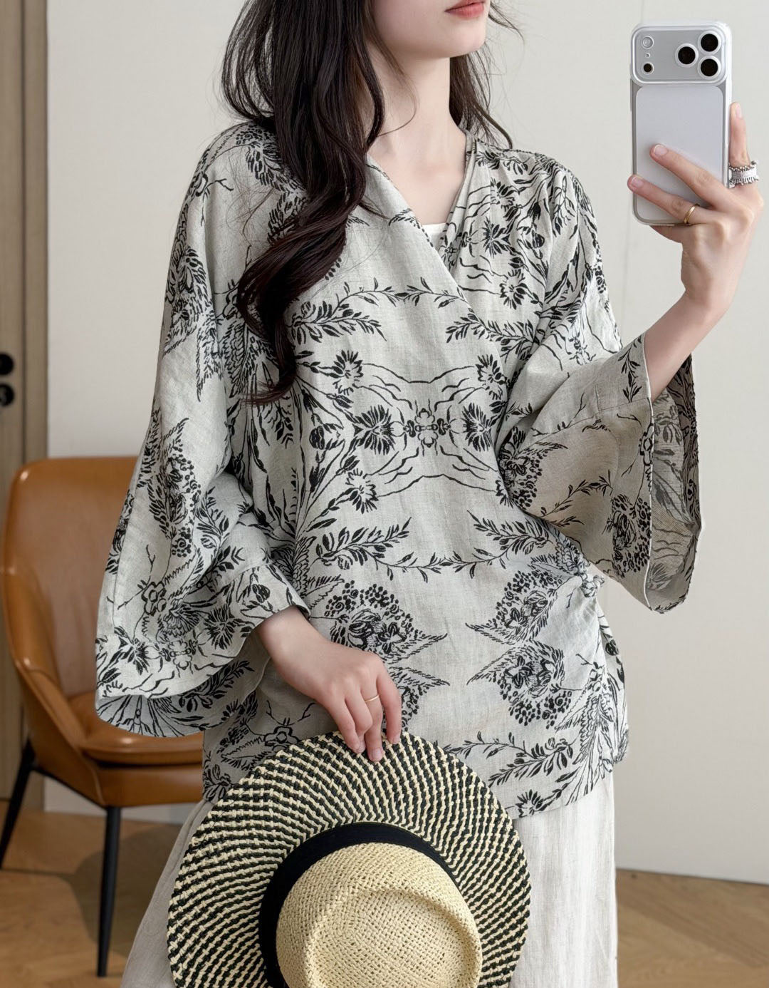 Women's black boho kimono styled over a casual outfit