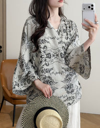 Women's black boho kimono styled over a casual outfit