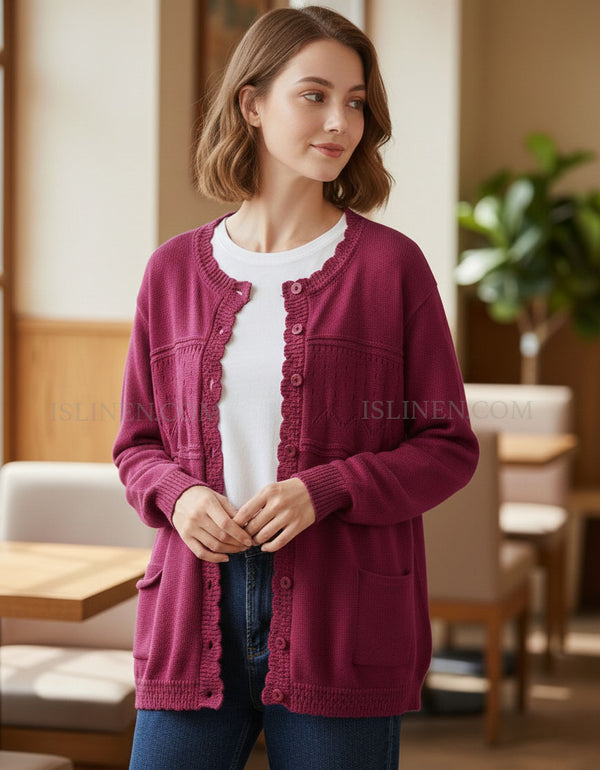 Woman wearing a maroon cardigan in an indoor setting