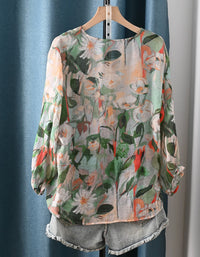 Lightweight floral button-up shirt paired with denim shorts